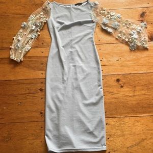 long blue skintight dress with puff flower sleeves